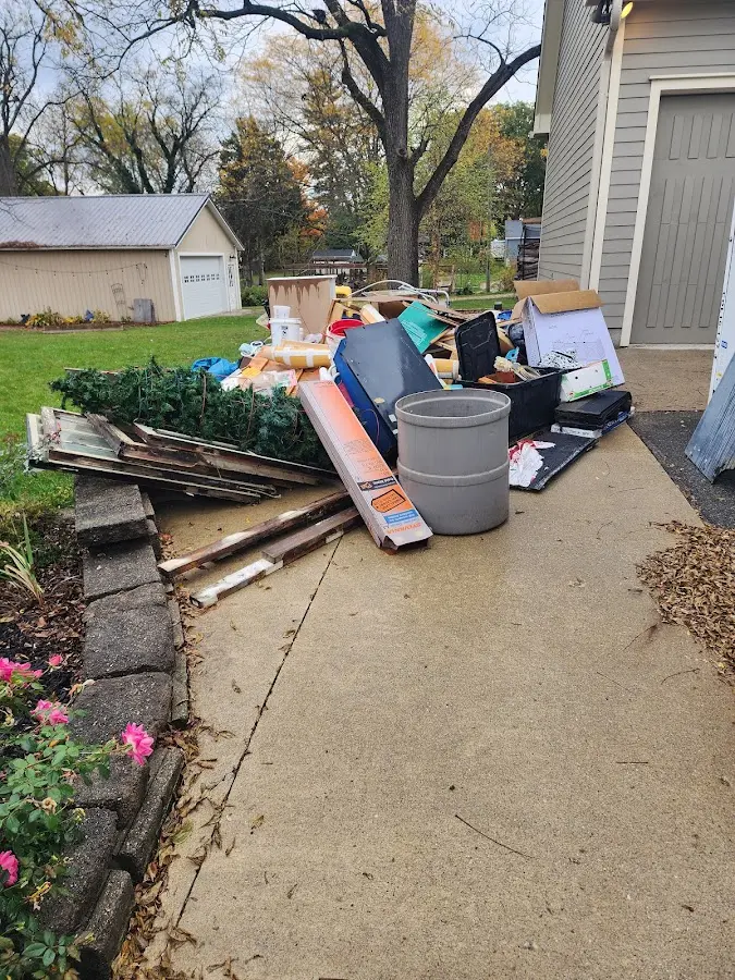 Dumpster being loaded with debris for Estate Cleanout Dumpster Rental in Chester